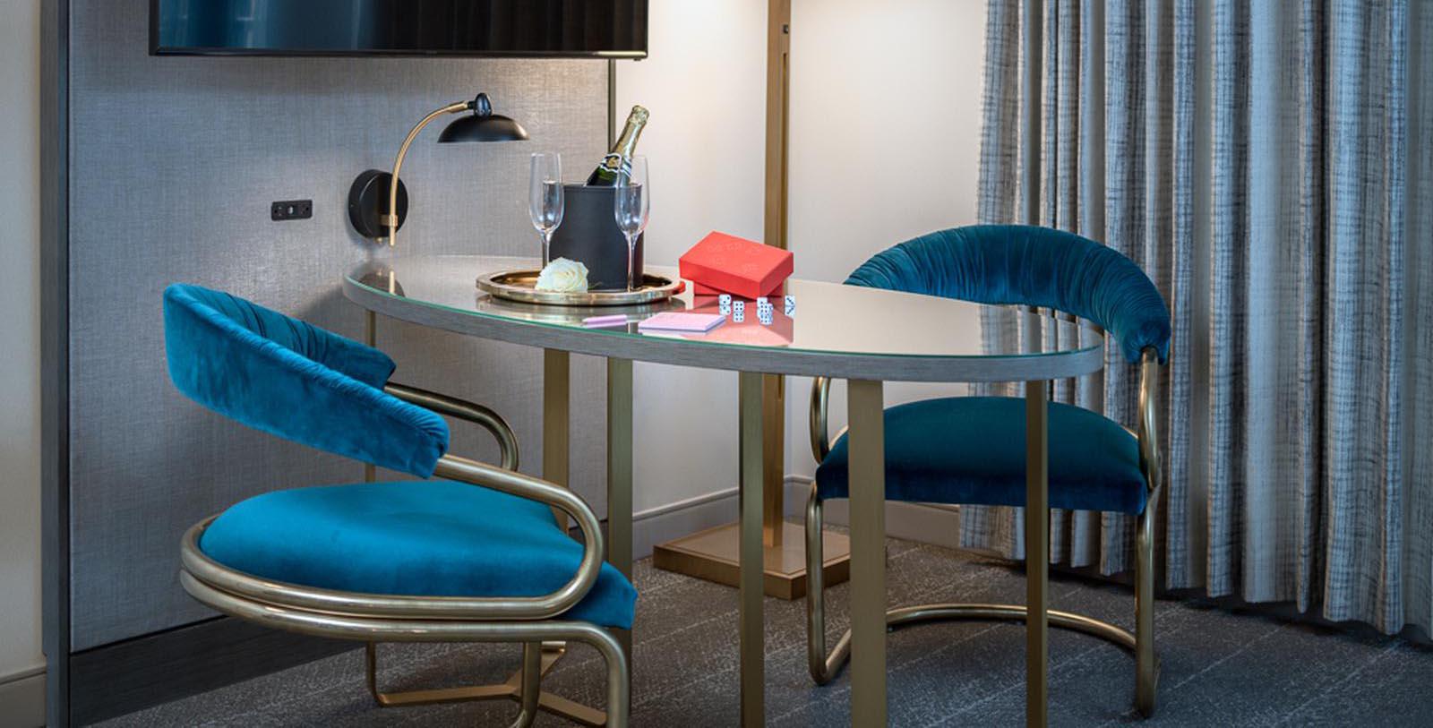 Image of table and chairs in guestroom Tulsa Club Hotel, Curio Collection by Hilton, 1927, Member of Historic Hotels of America, in Tulsa, Oklahoma, Explore